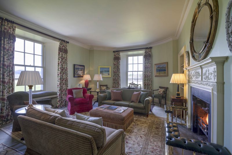 Interior of renovated sitting room in a country house on the Isle of Mull. Comfortable furnishings, heritage paint colours.